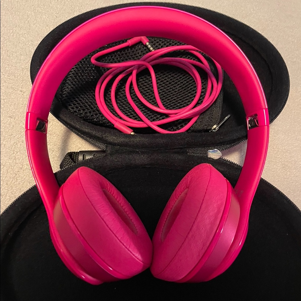 Pink wired Beats with case